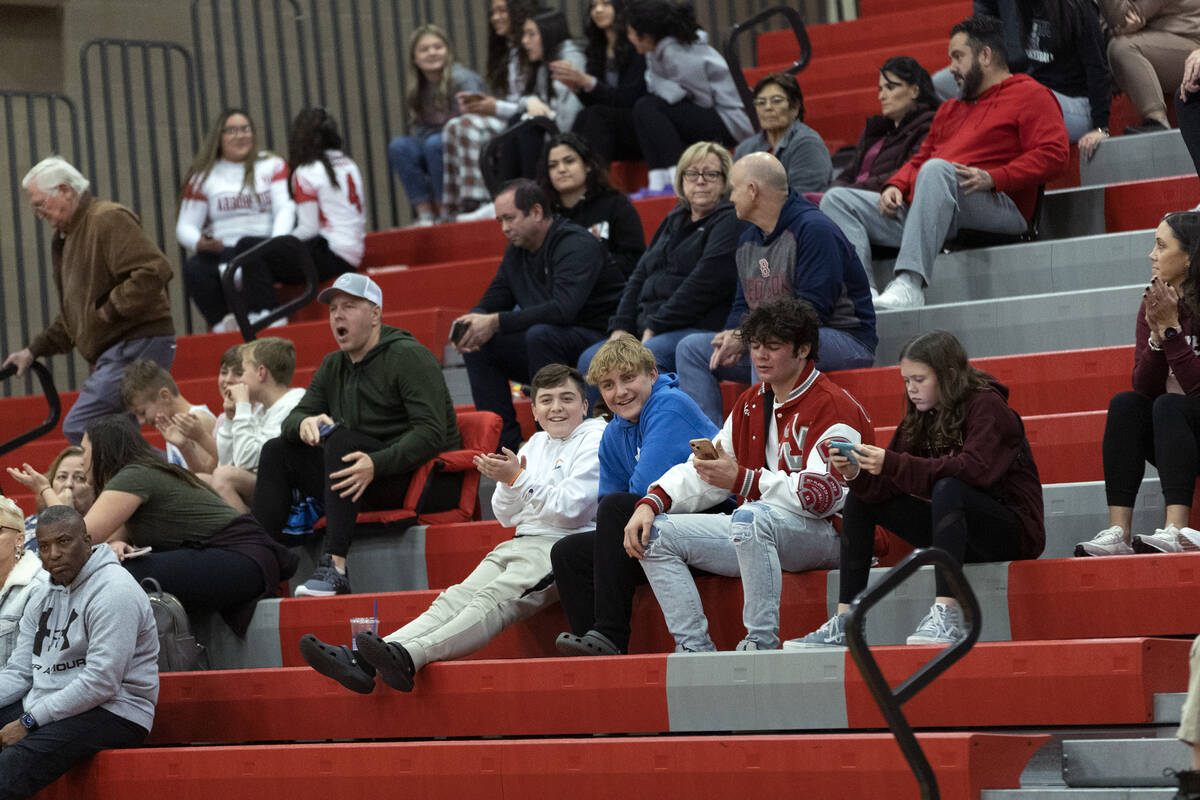 The Arbor View fan section gives mild applause after their team won a boys high school basketba ...