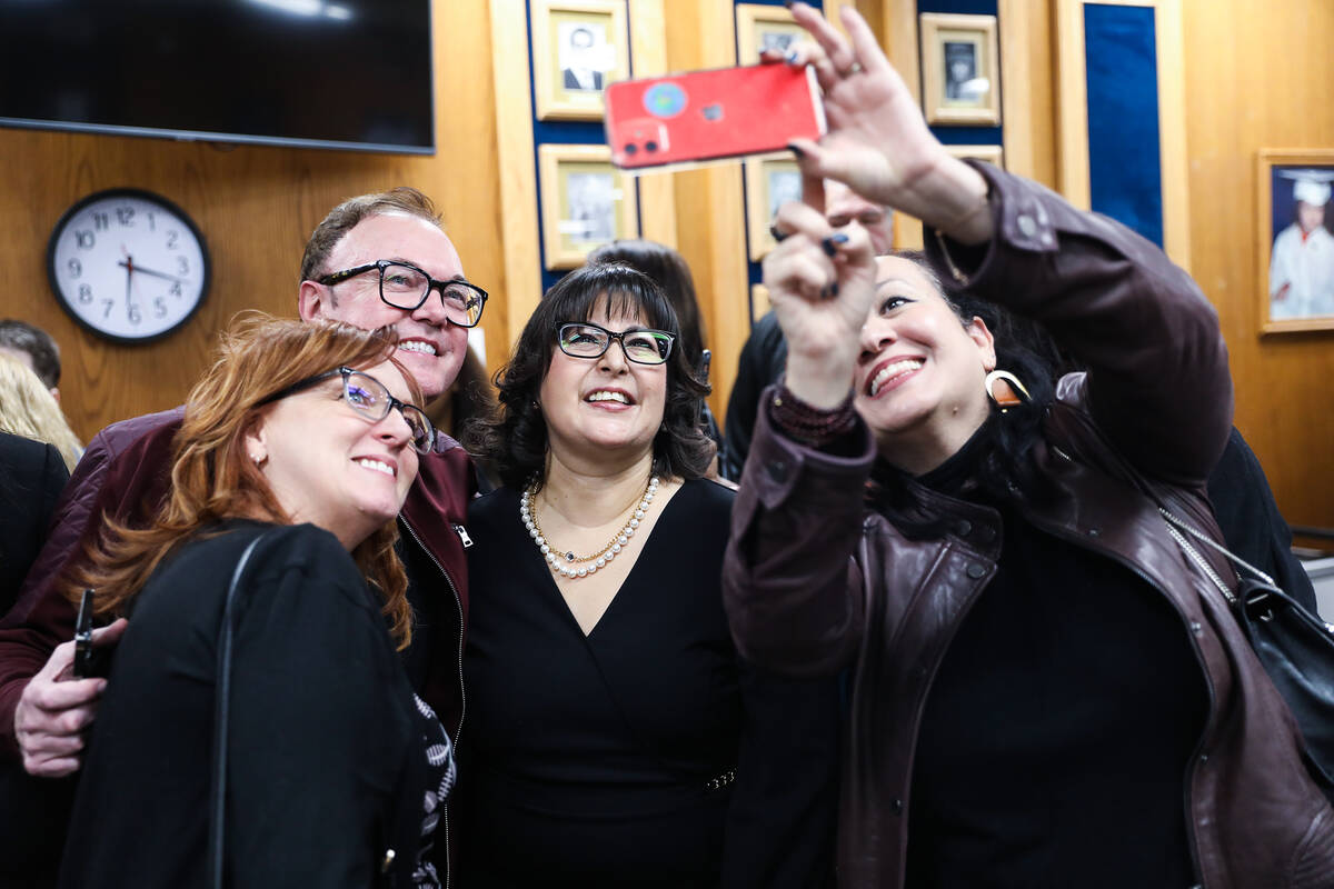 Newly elected School Board Trustee Irene Bustamante Adams, center, takes a photo with Jennifer ...