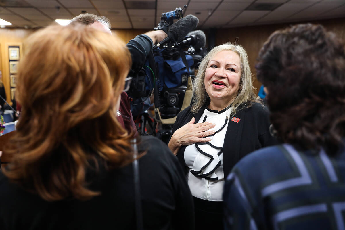 School Board Trustee Linda Cavazos speaks with supporters after a special meeting where she and ...