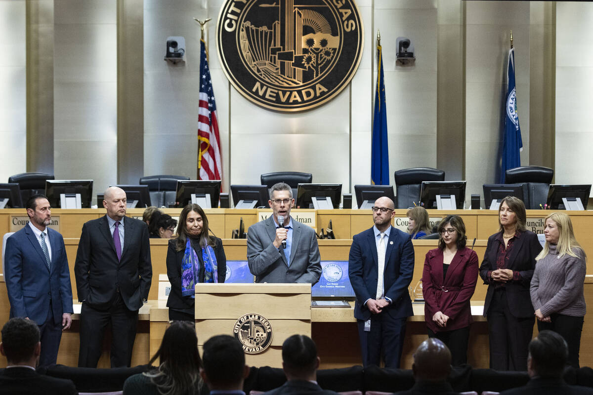 Glenn Cook, center, executive editor and senior vice president for news at Las Vegas Review-Jou ...