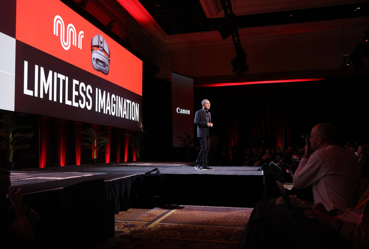 Kazuto “Kevin” Ogawa, president and CEO of Canon Americas, speaks to members of the news me ...