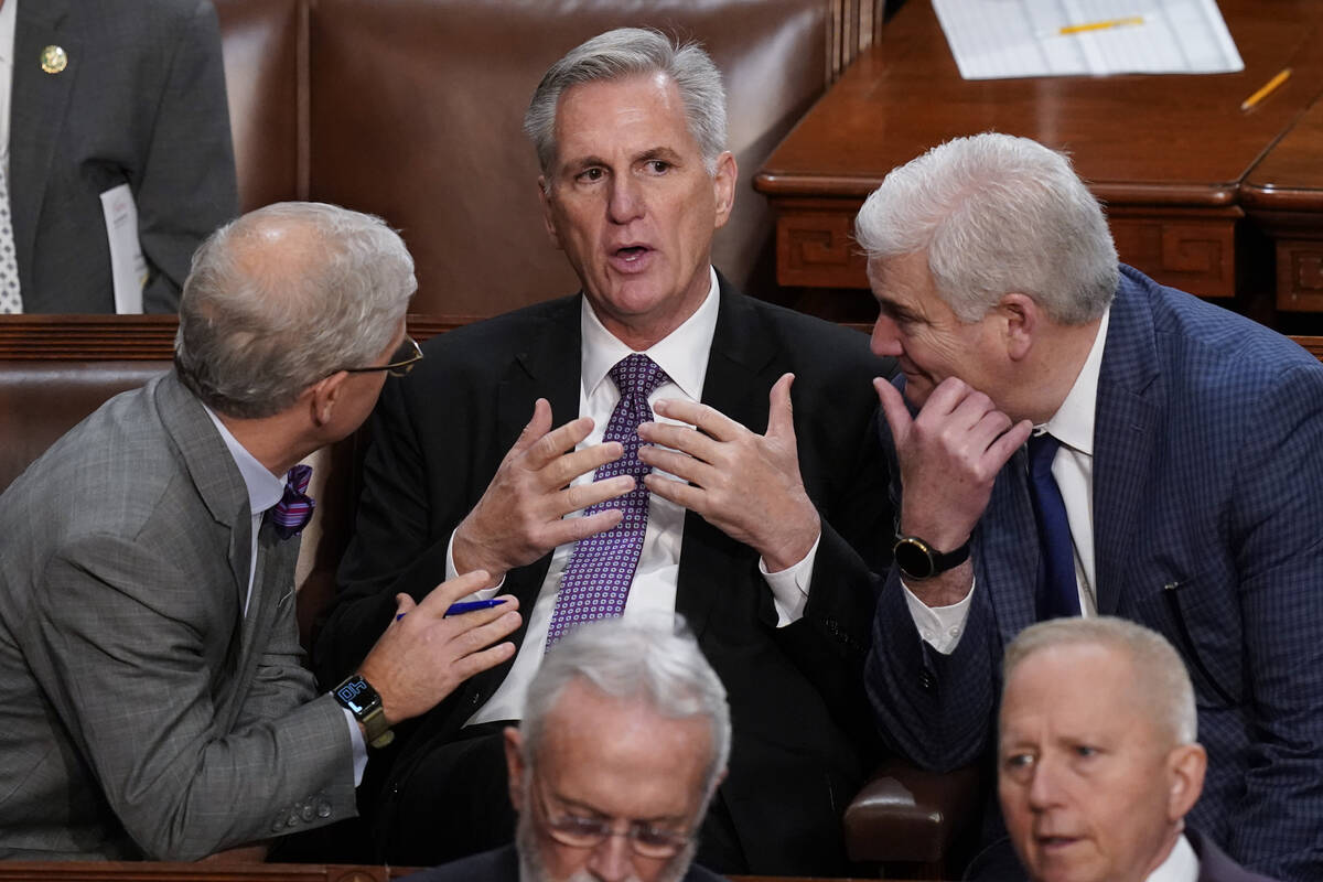 Rep. Patrick McHenry, R-N.C., left, and Rep. Tom Emmer, R-Minn., right, speaks with Rep. Kevin ...