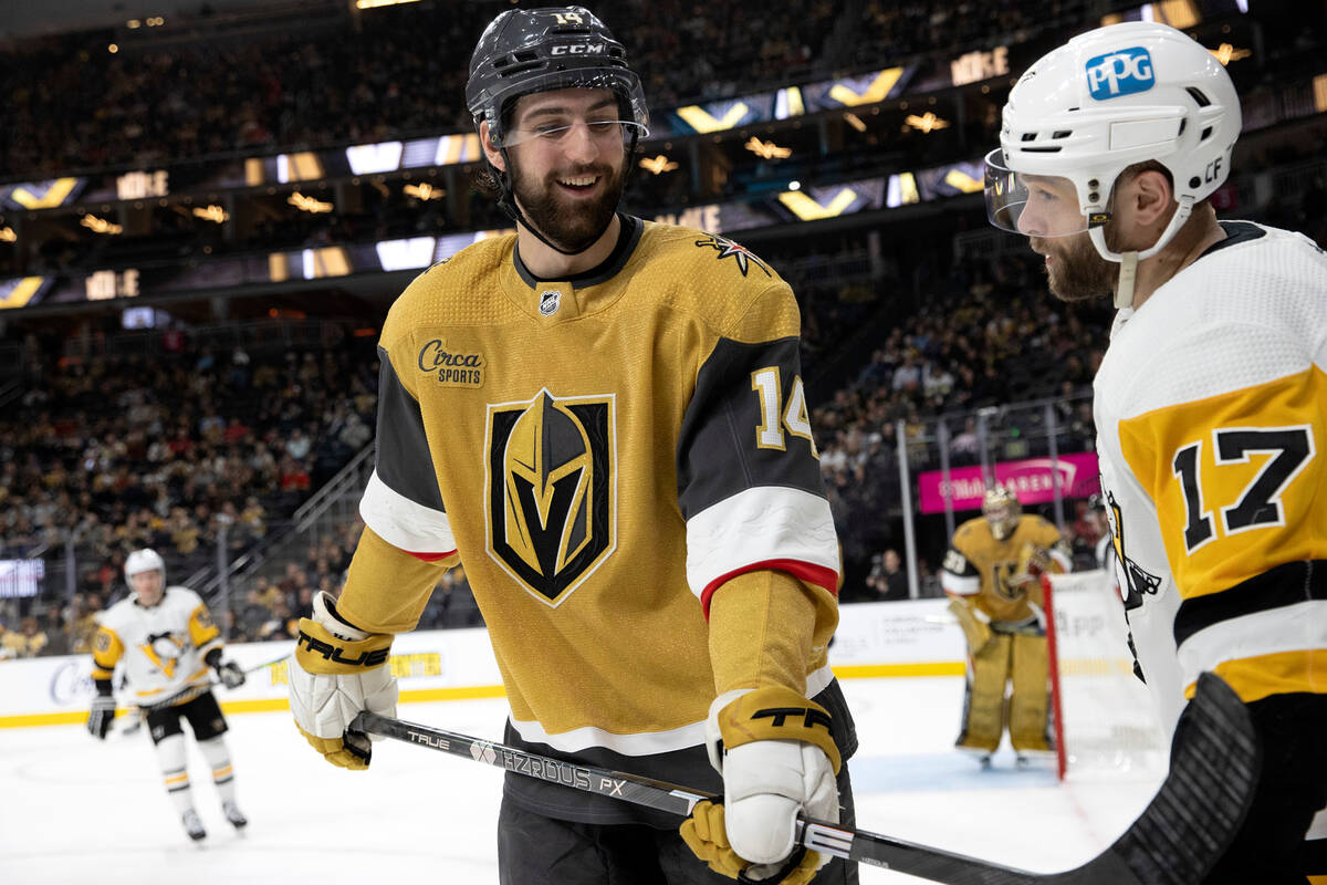 Vegas Golden Knights defenseman Nicolas Hague (14) and Pittsburgh Penguins right wing Bryan Rus ...