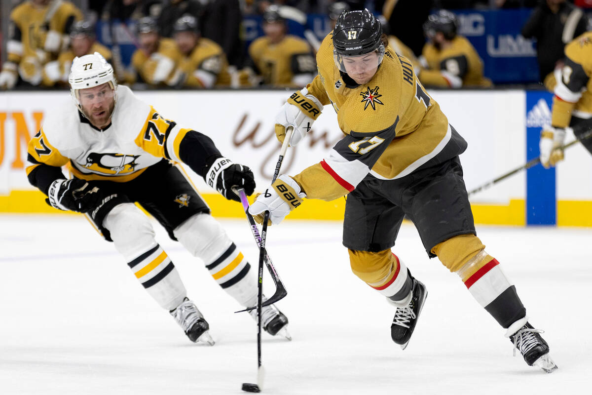 Vegas Golden Knights defenseman Ben Hutton (17) passes the puck while skating against Pittsburg ...