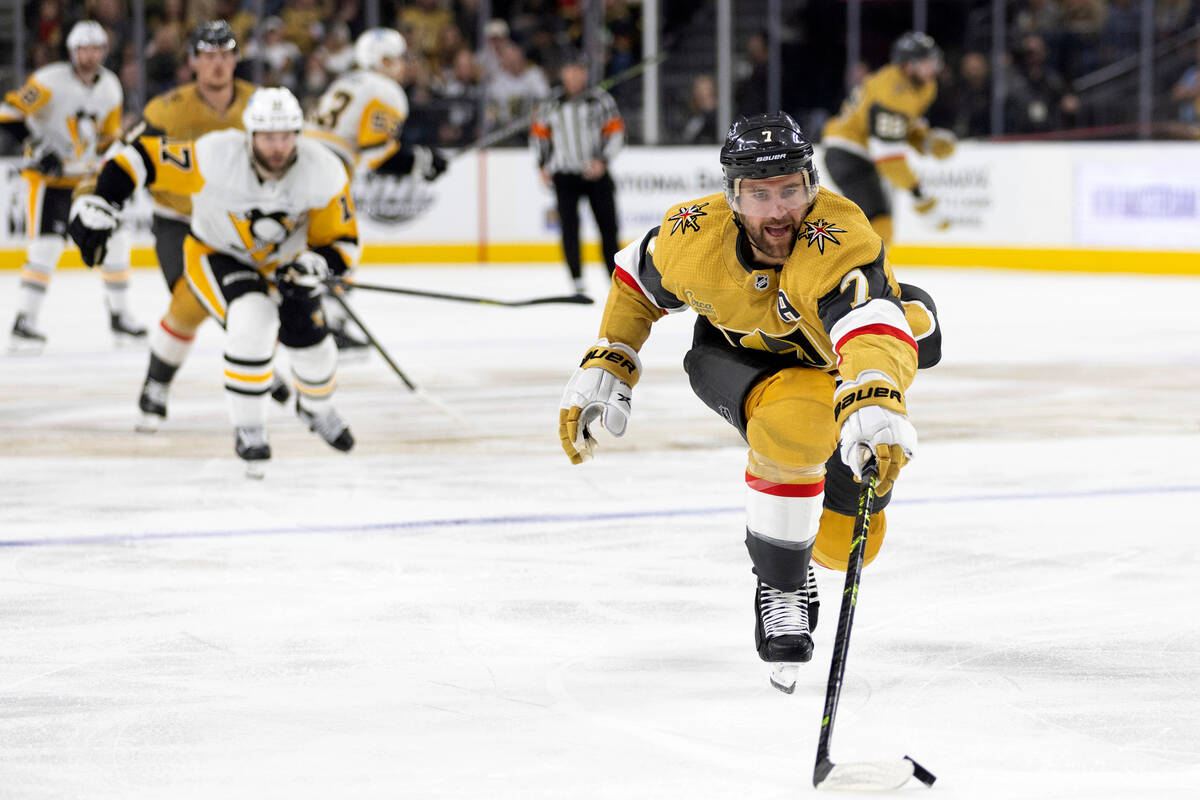 Vegas Golden Knights defenseman Alex Pietrangelo (7) reaches for the puck during the first peri ...