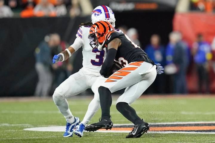 Cincinnati Bengals wide receiver Tee Higgins (85) runs near Buffalo Bills safety Damar Hamlin ( ...