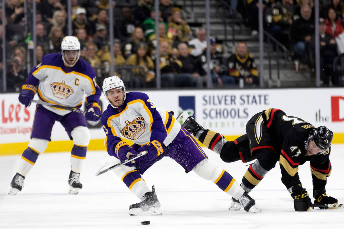 Los Angeles Kings defenseman Matt Roy (3) passes the puc, while Vegas Golden Knights center Pau ...