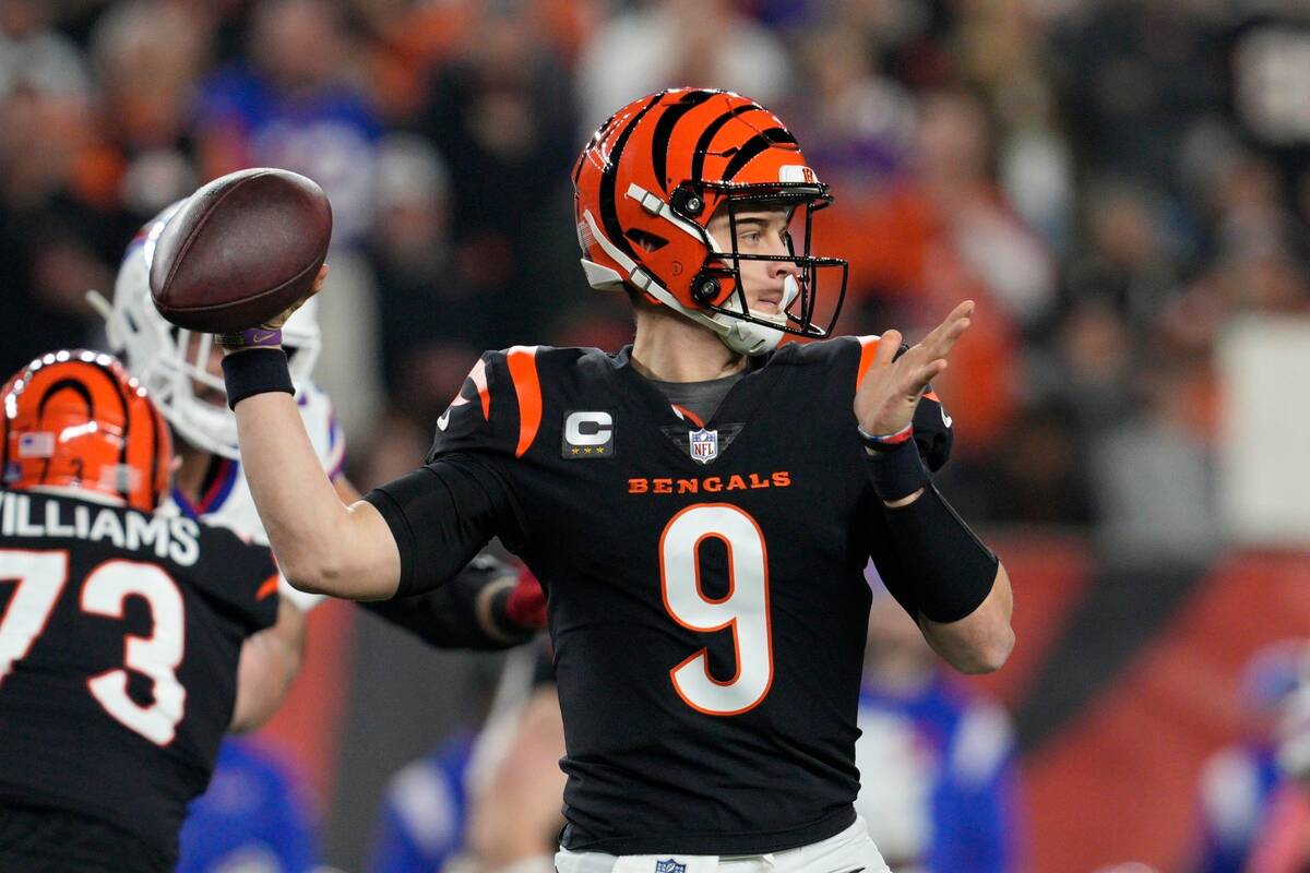 Cincinnati Bengals quarterback Joe Burrow (9) throws during the first half of an NFL football g ...