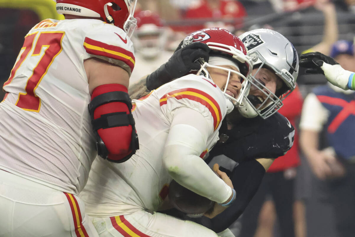 Raiders defensive end Maxx Crosby (98) sacks Kansas City Chiefs quarterback Patrick Mahomes (15 ...