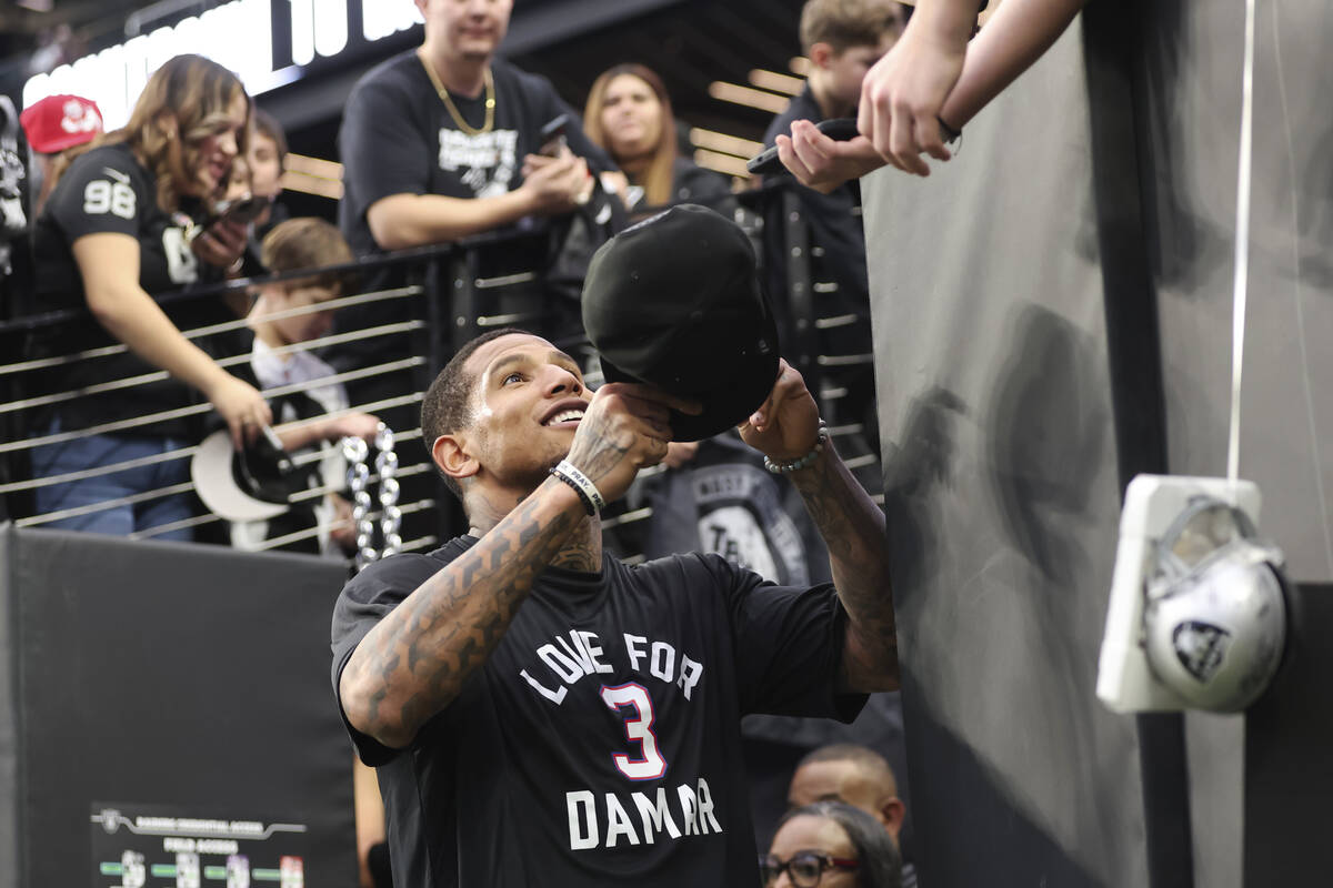 Raiders tight end Darren Waller, wearing a shirt in support of Buffalo Bills’ Damar Haml ...