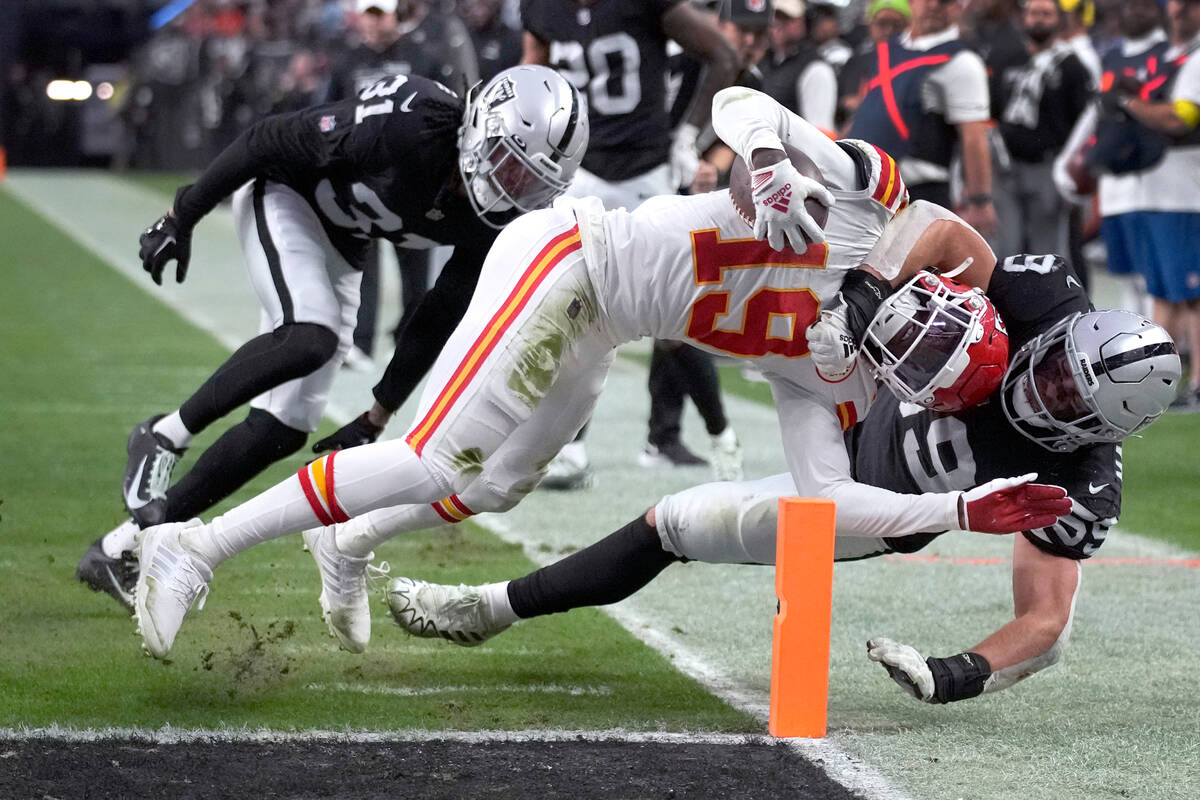 Kansas City Chiefs wide receiver Kadarius Toney (19) scores as Las Vegas Raiders linebacker Luk ...