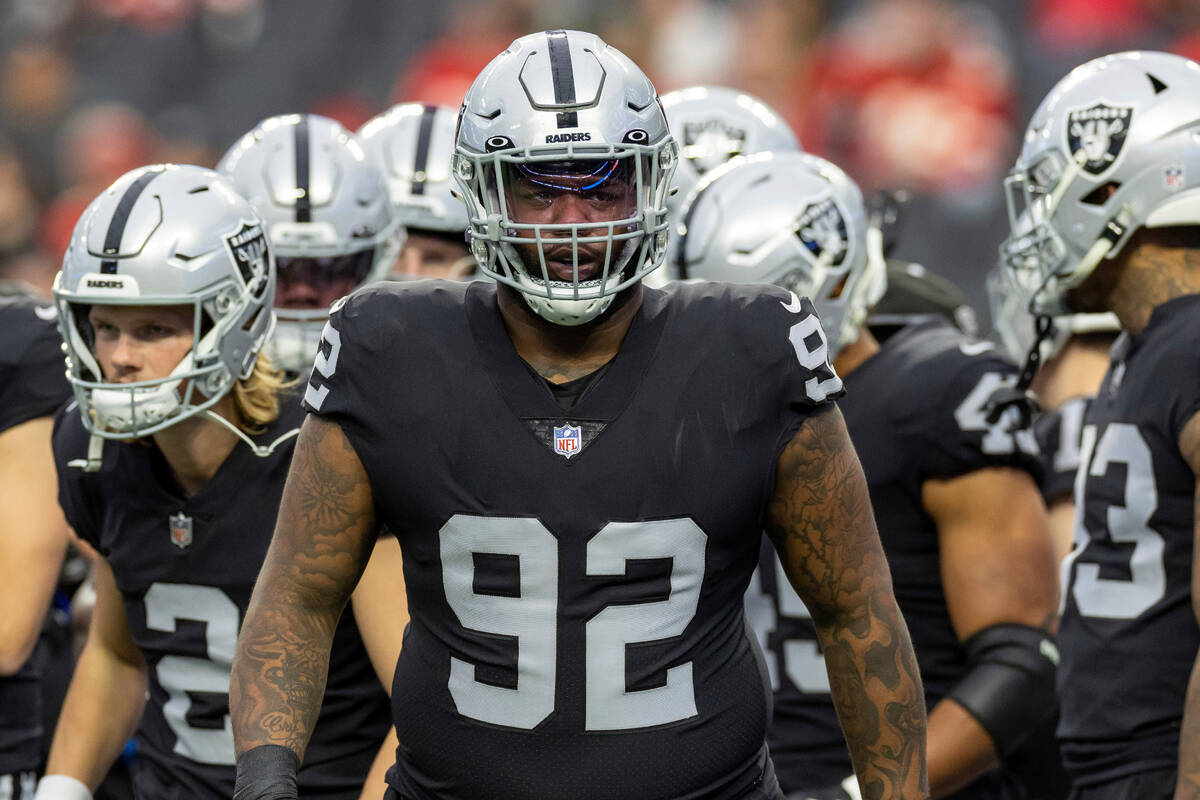 Las Vegas Raiders defensive tackle Neil Farrell, Jr. (92) warms up before playing against the K ...