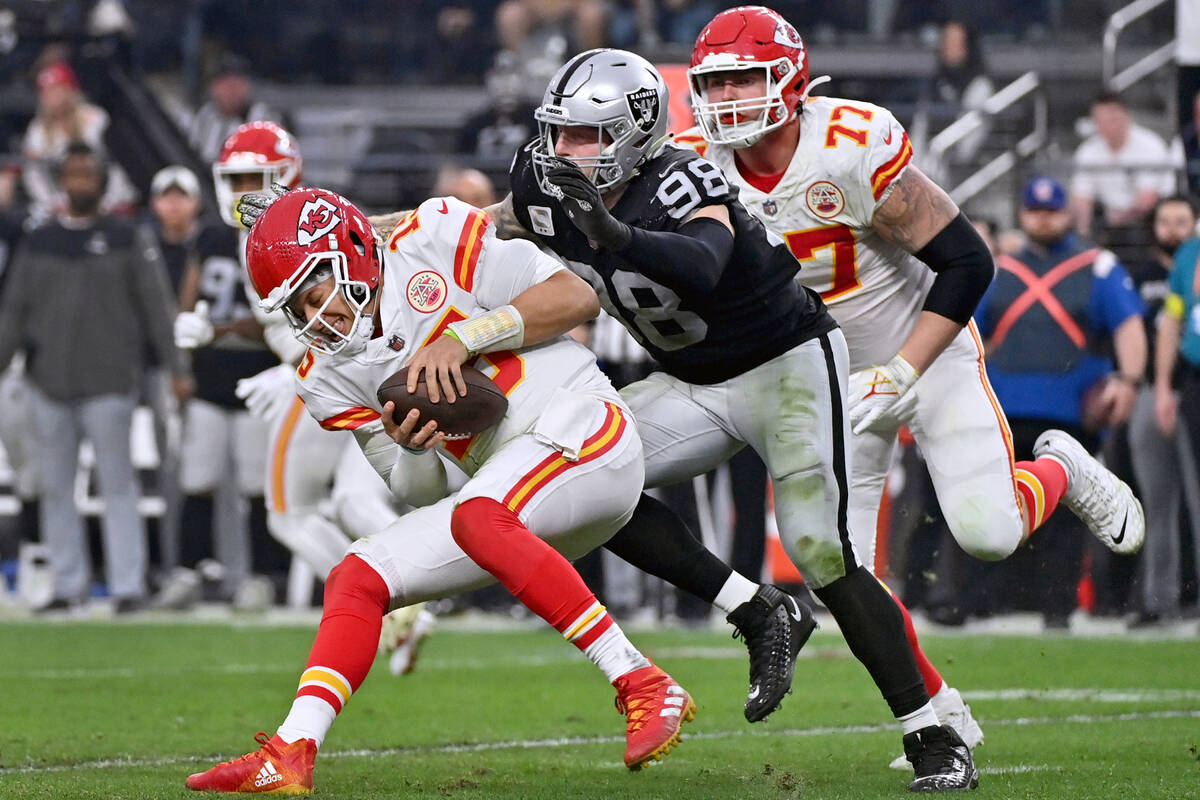 Kansas City Chiefs quarterback Patrick Mahomes (15) is sacked by Las Vegas Raiders defensive en ...