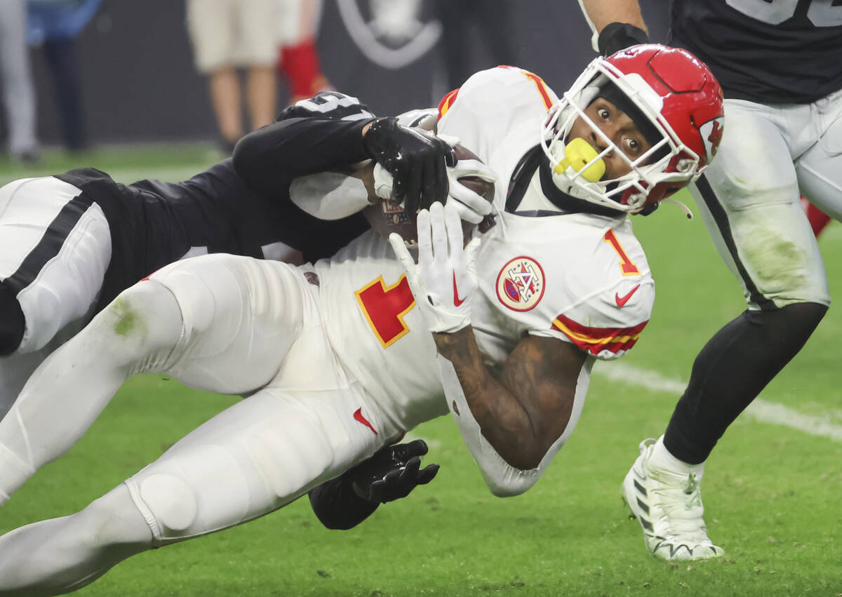 Raiders cornerback Sidney Jones IV (31) tackles Kansas City Chiefs running back Jerick McKinnon ...