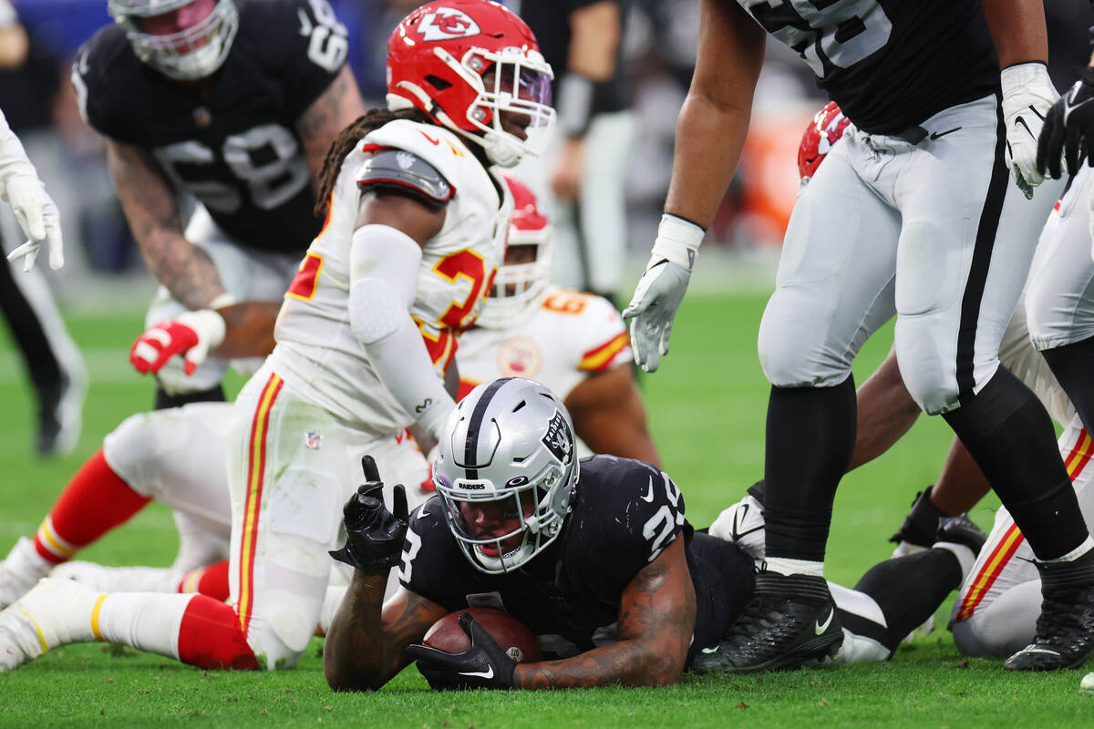 Las Vegas Raiders running back Josh Jacobs (28) gestures first down after a run against the Kan ...