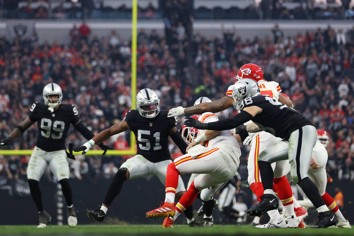 Las Vegas Raiders defensive end Maxx Crosby (98) sacks Kansas City Chiefs quarterback Patrick M ...