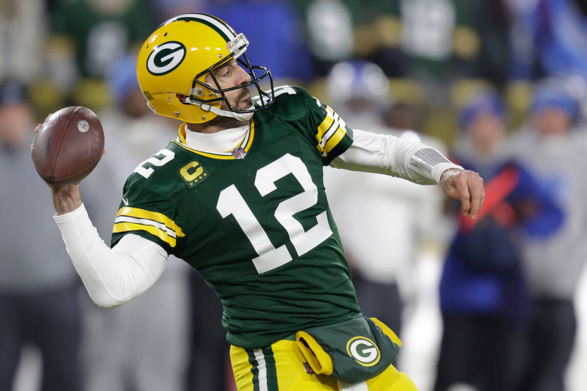 Green Bay Packers quarterback Aaron Rodgers throws during the first half of an NFL football gam ...