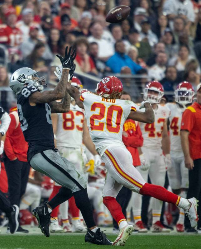 Kansas City Chiefs safety Justin Reid (20) defends a pass intended for Raiders tight end Darren ...