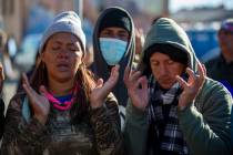 Venezuelan migrants pray at the camping site outside the Sacred Heart Church in downtown El Pas ...