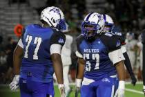 Basic High's Antoine Taylor jr. (57) reacts after making a play during the second half of a foo ...