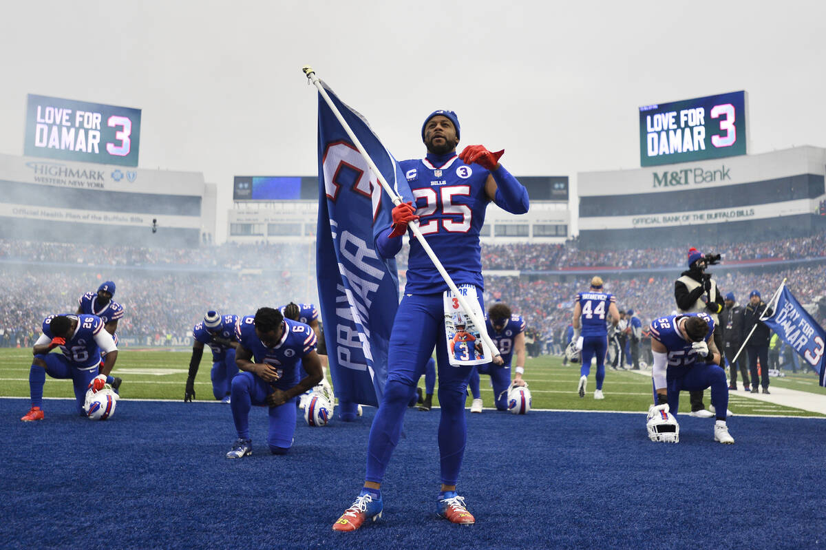 Buffalo Bills running back Taiwan Jones (25) kneels in prayer for safety Damar Hamlin before an ...