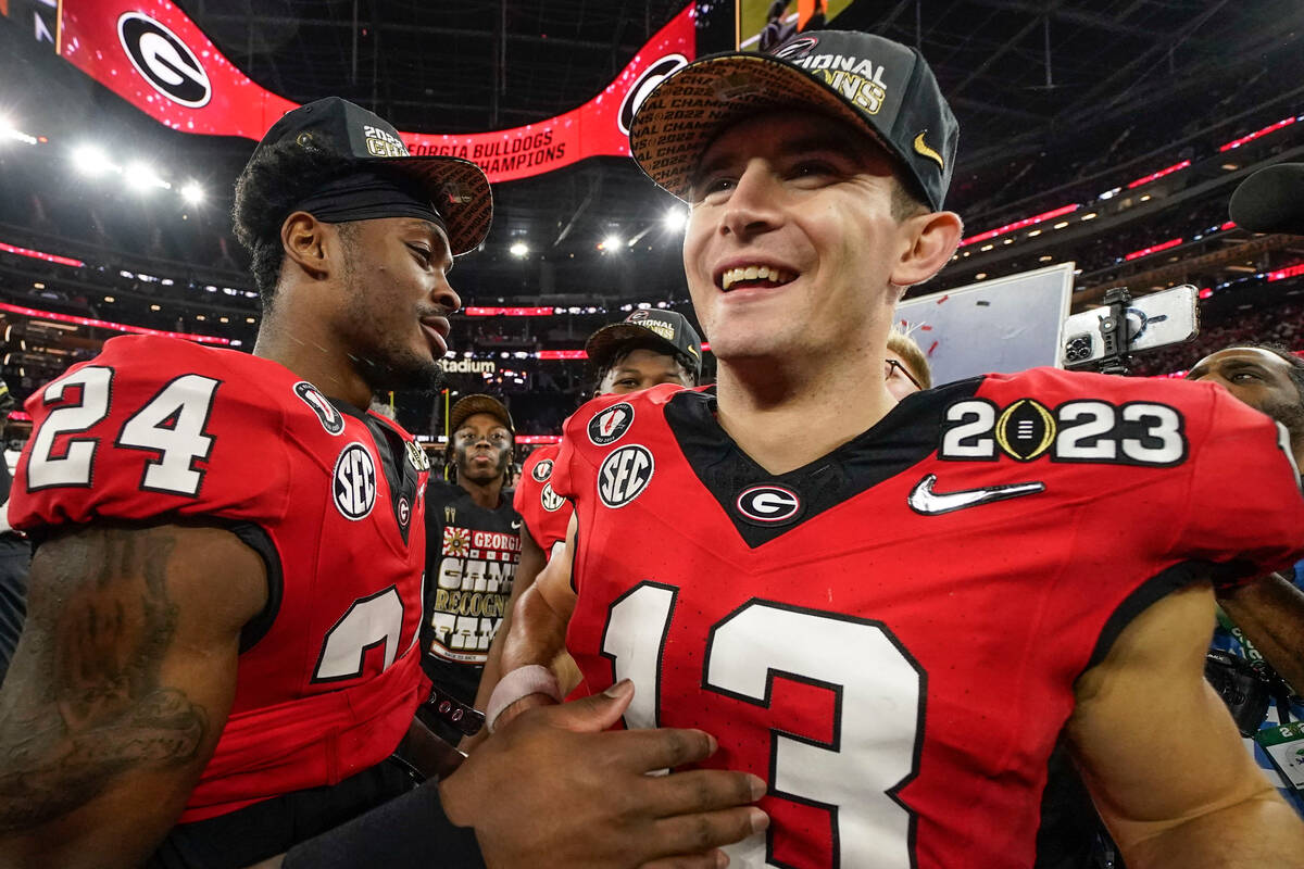 Georgia quarterback Stetson Bennett (13) celebrates victory over TCU after the national champio ...