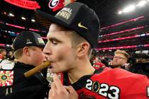 Georgia quarterback Stetson Bennett (13) celebrates victory over TCU after the national champio ...