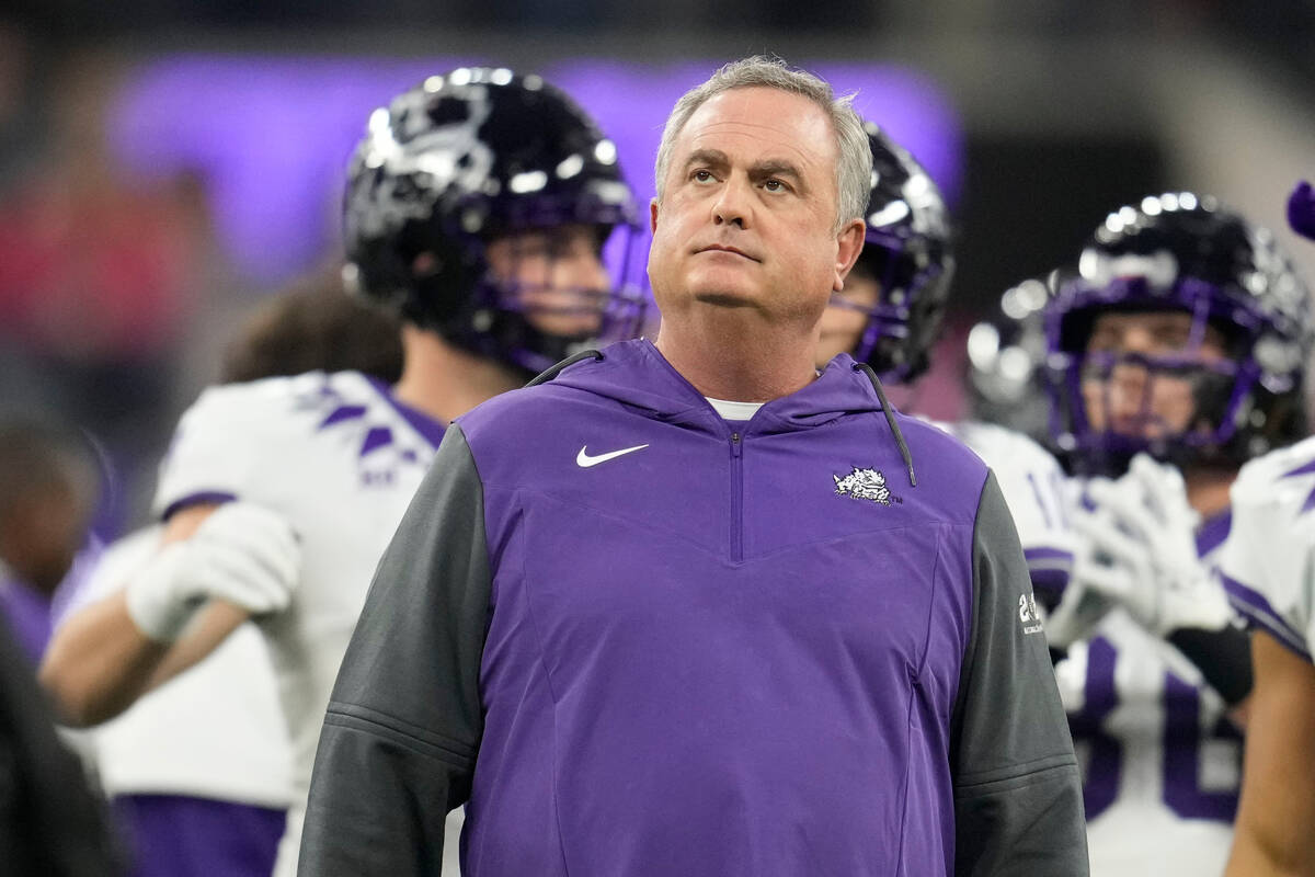 TCU head coach Sonny Dykes watches teams warm up before the national championship NCAA College ...