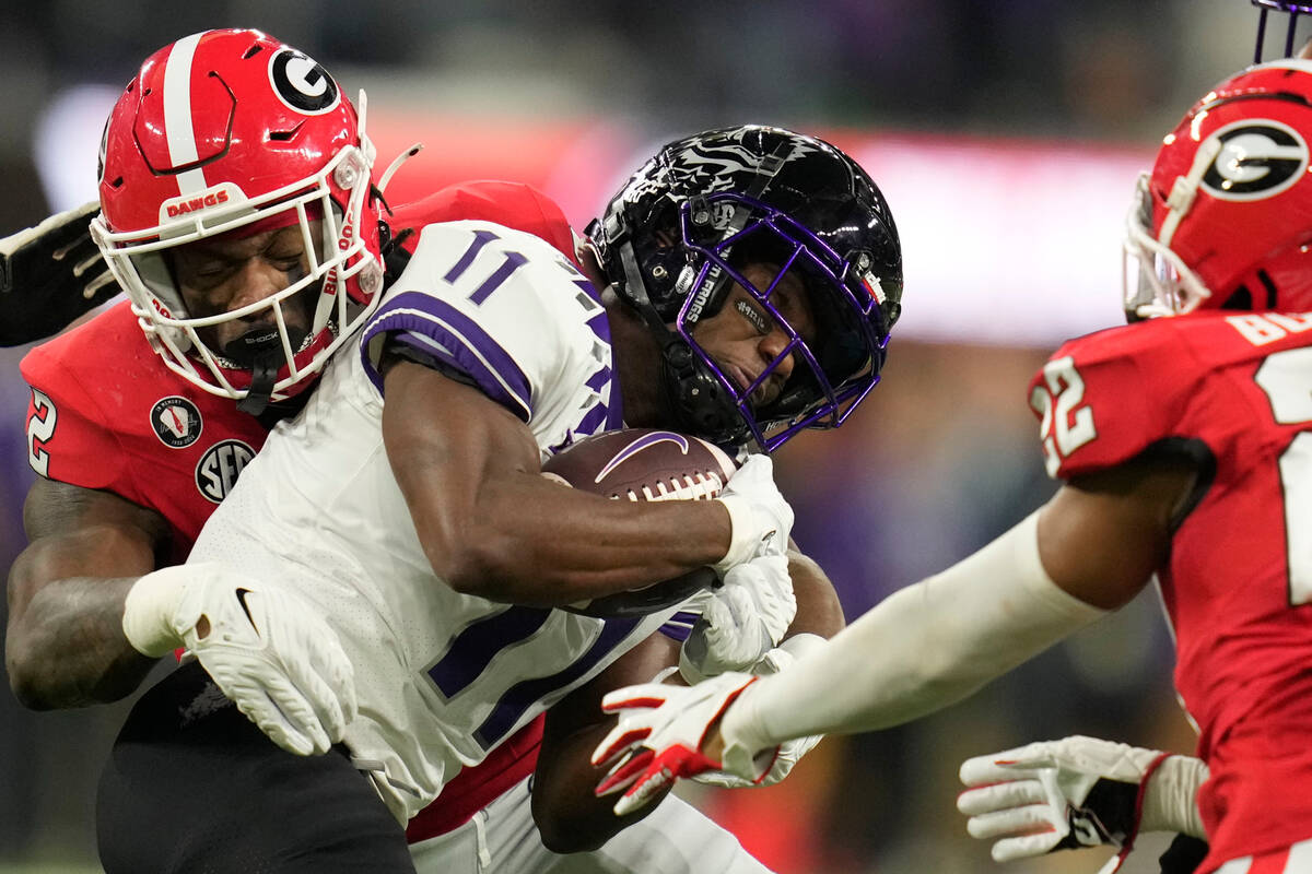 TCU wide receiver Derius Davis (11) runs into Georgia defensive back Javon Bullard (22) during ...