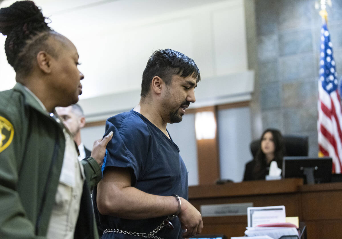 Mohammed Mesmarian, who is facing arson and terrorism charges, is led out of the courtroom afte ...