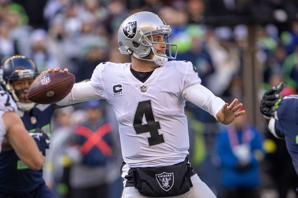 Raiders quarterback Derek Carr (4) prepares to throw during the first half of an NFL game again ...