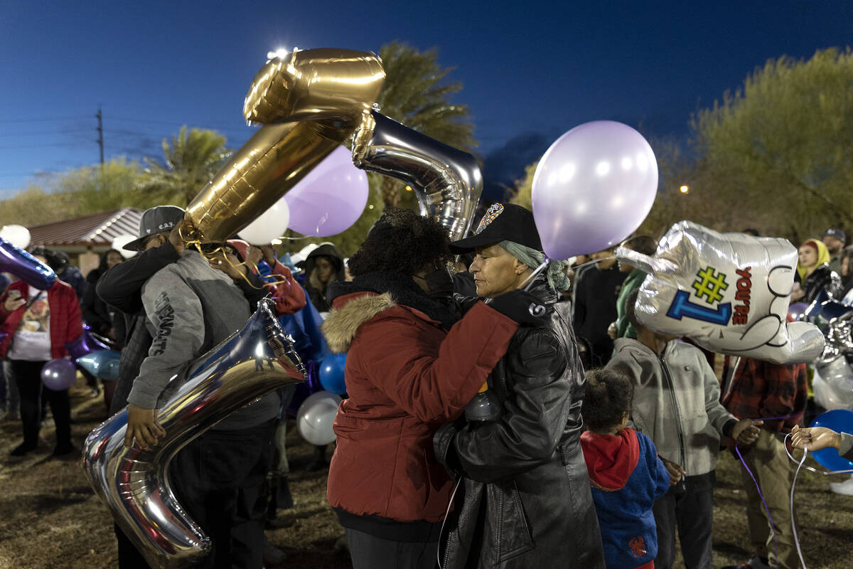 Ashari Hughes’ grandmothers Jackie Toles, center left, and Delores Green, center right, ...