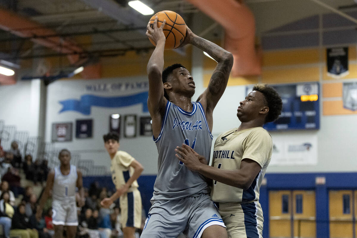 Desert Pines’ Evan Tatum (11) attempts to pass against Foothill’s Justin Brulee ( ...