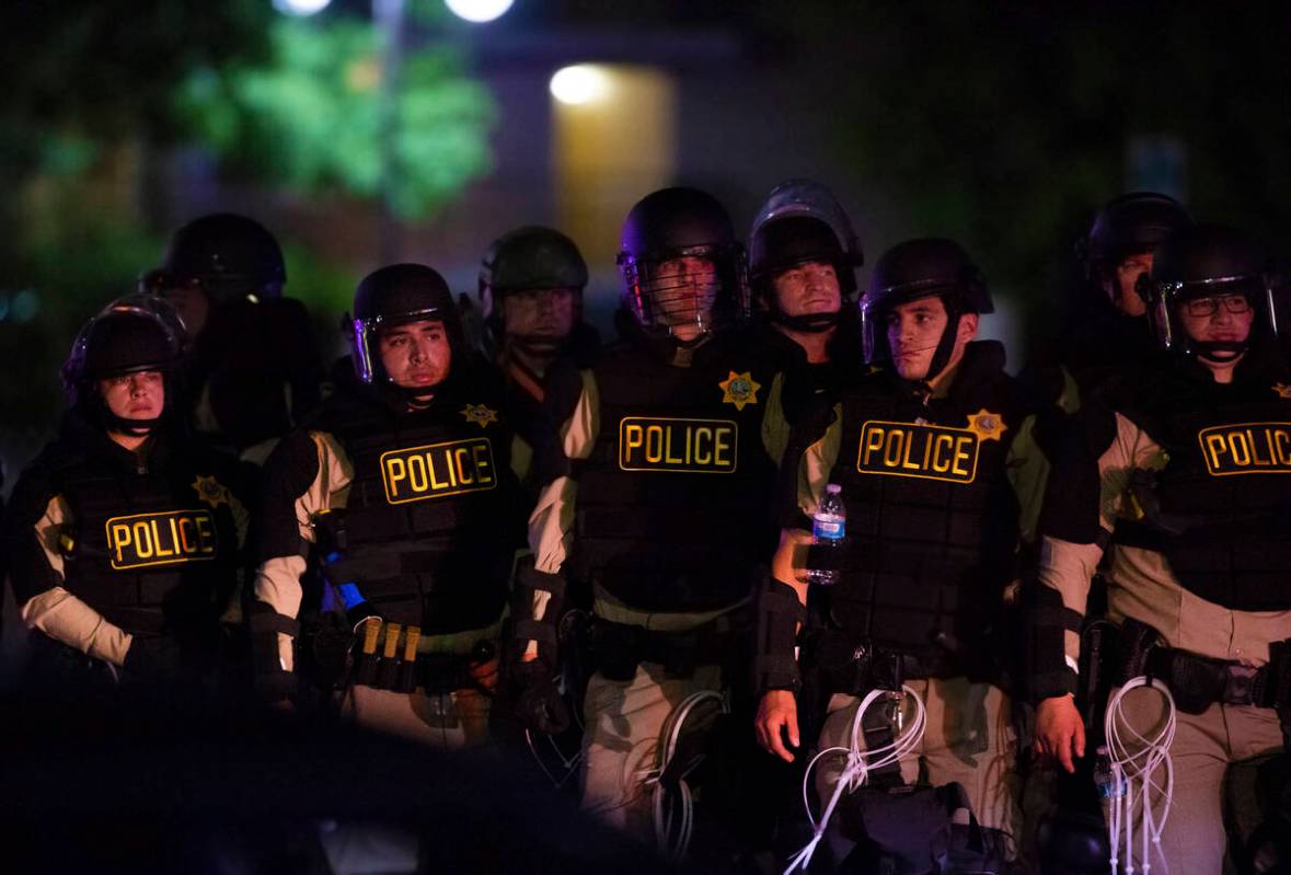 Police patrol Fremont Street during a protest organized by Black Lives Matter in downtown Las V ...