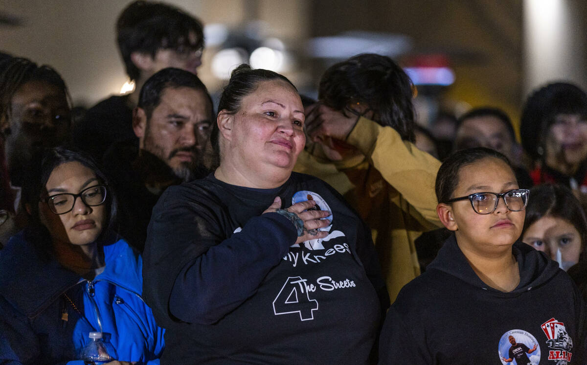 Angela Dominguez is moved while hearing kind words spoken of her husband Jonet Dominguez during ...