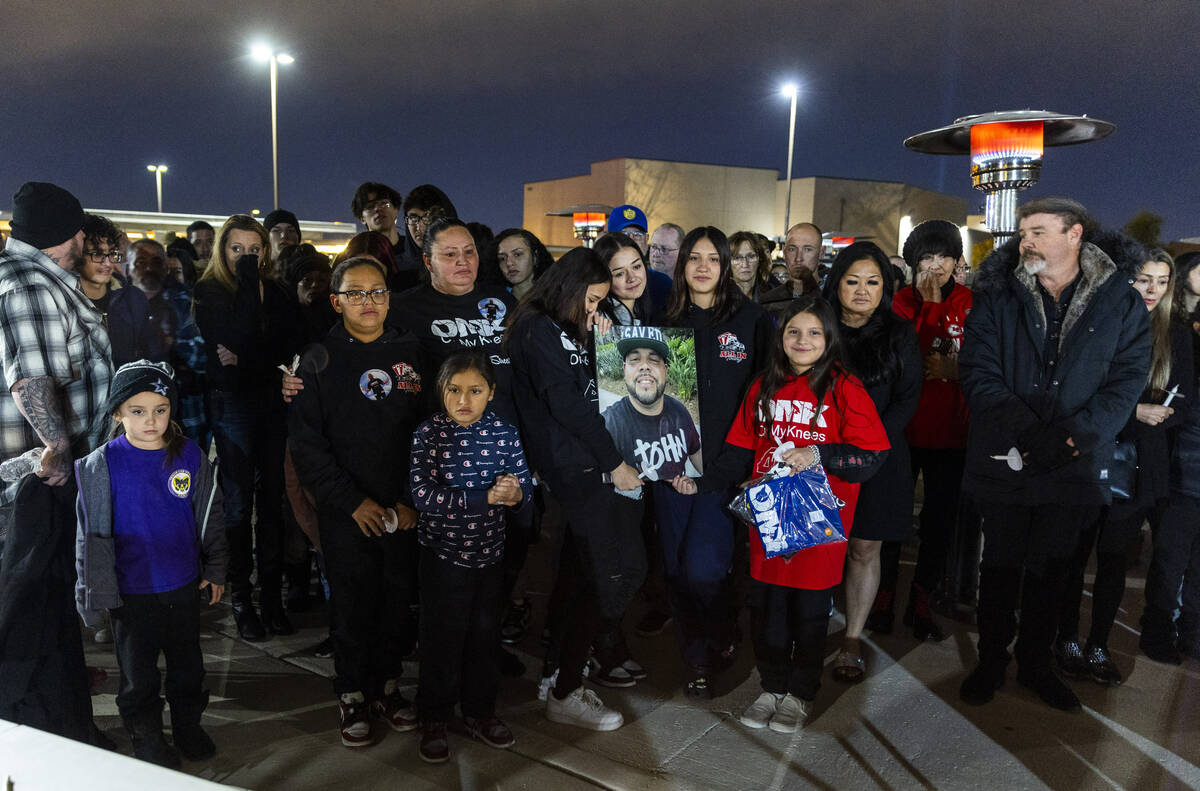 Family and friends of Jonet Dominguez honor him during a candlelight vigil at Awaken Las Vegas ...