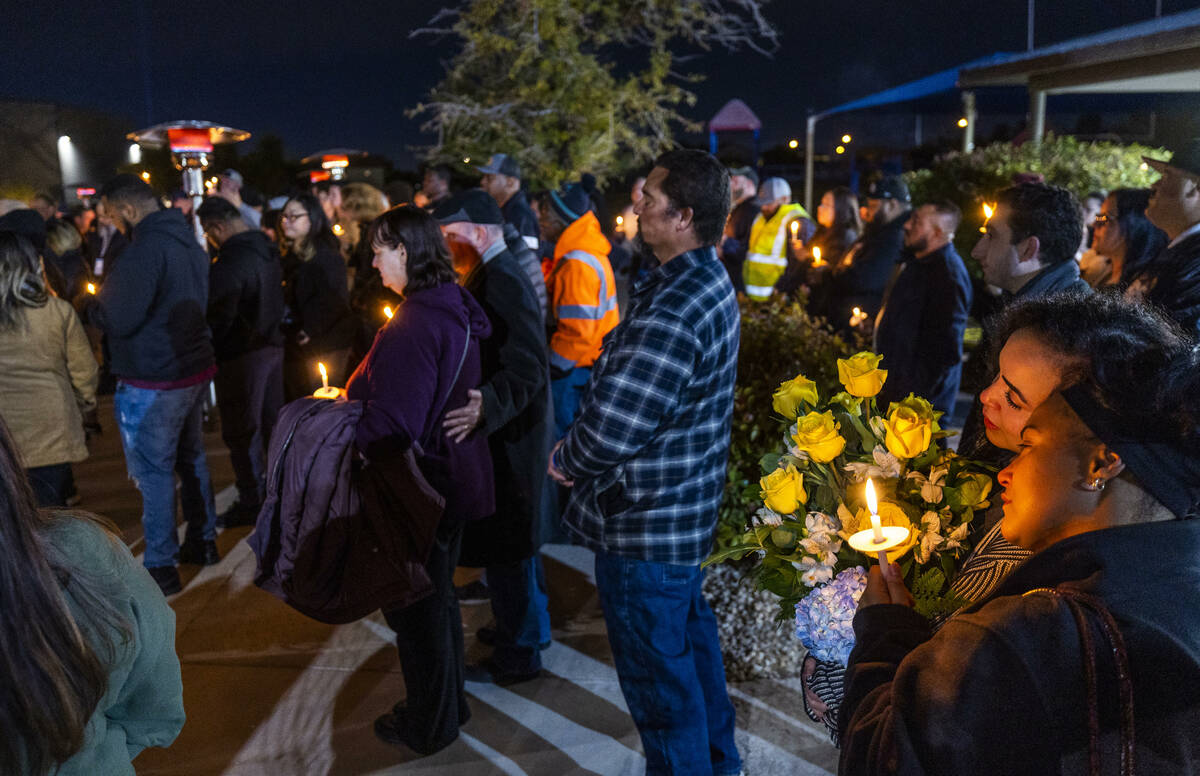 Family and friends of Jonet Dominguez honor him during a candlelight vigil at Awaken Las Vegas ...