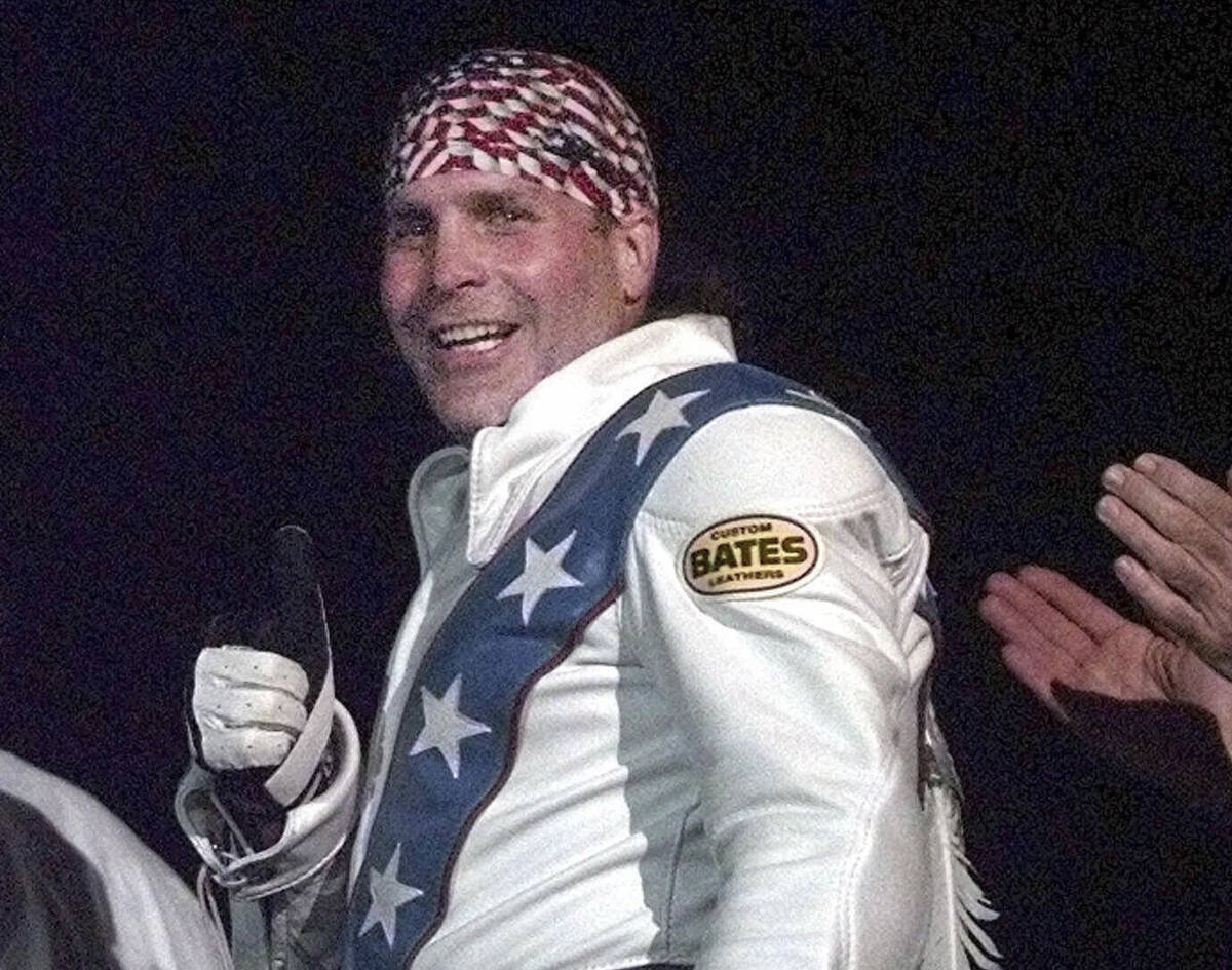 FILE - Robbie Knievel gives a thumbs up after jumping a train at the Texas State Railroad Park ...