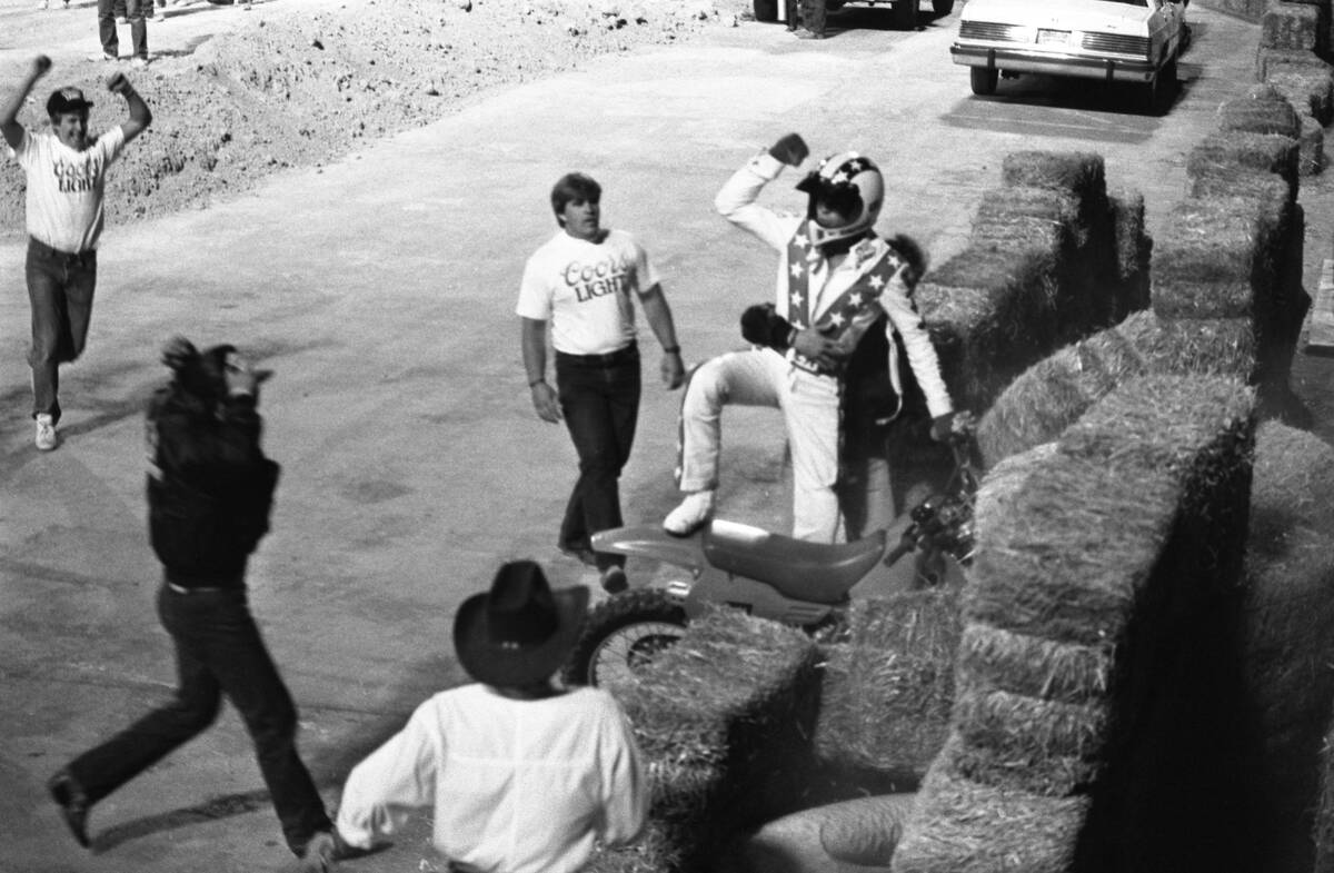 Robbie Knievel jumps his motorcycle 153 1/2 feet over 22 parked cars in May 1987 at Sam Boyd St ...