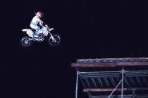 Robbie Knievel descends toward the landing ramp of his 130 foot motorcycle jump from top of the ...