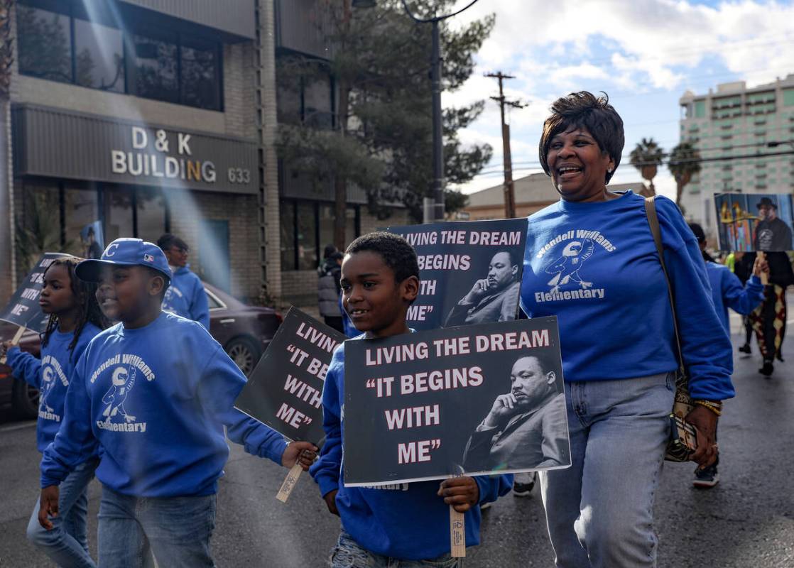 Kids from Wendell P. Williams Elementary School walk in the 41st annual Martin Luther King Jr. ...