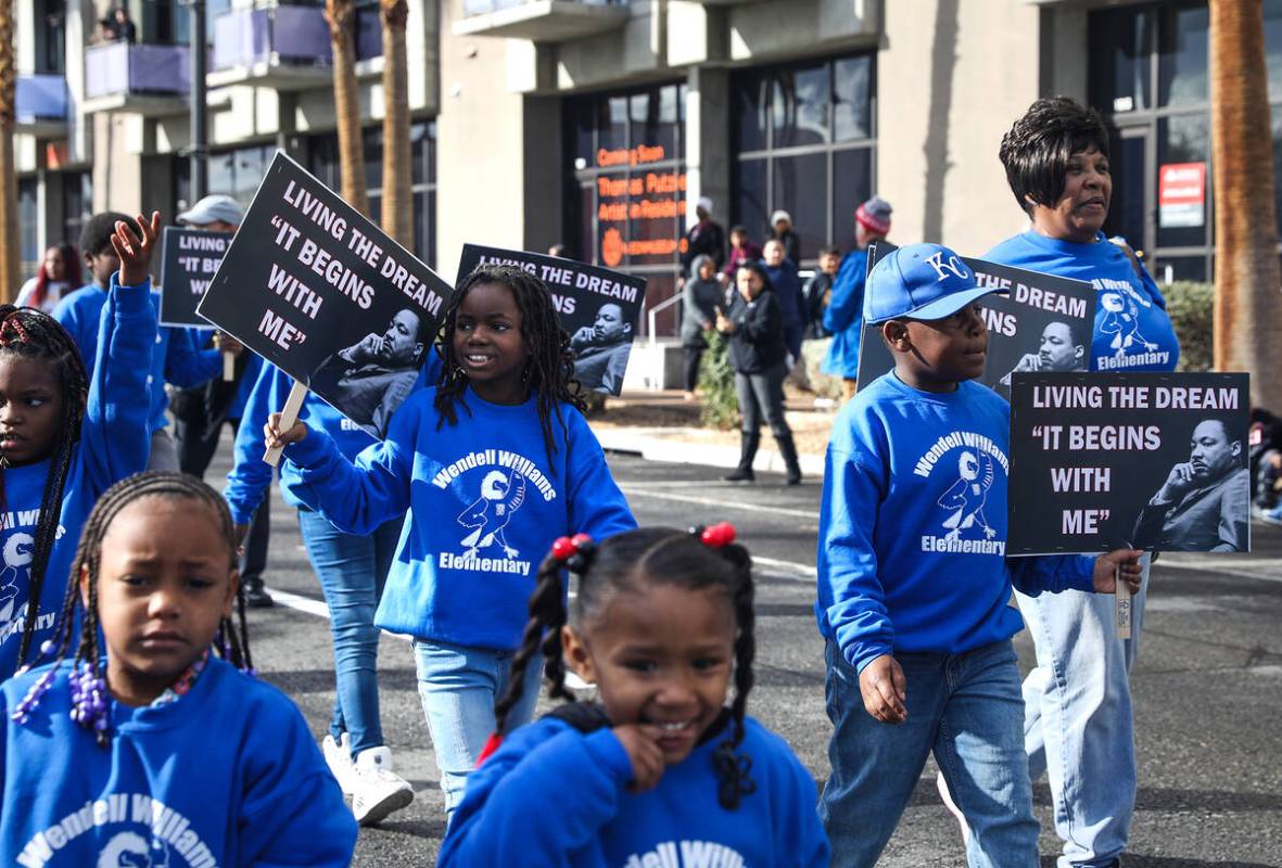 Kids from Wendell P. Williams Elementary School walk in the 41st annual Martin Luther King Jr. ...