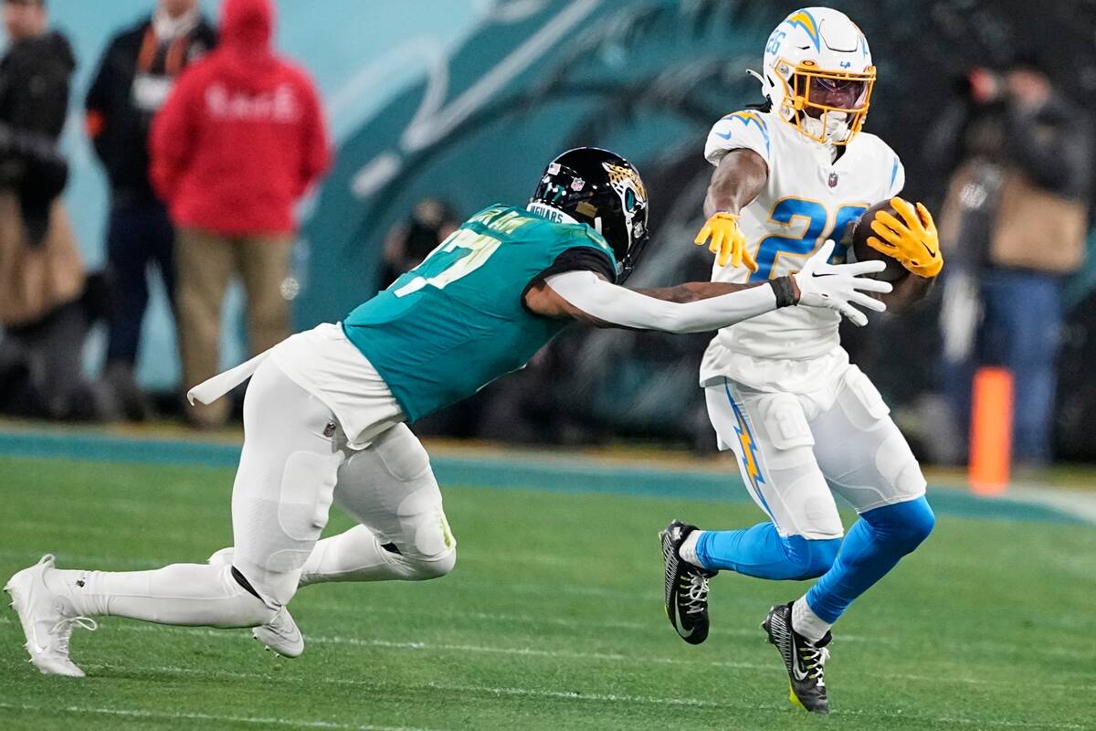 Los Angeles Chargers cornerback Asante Samuel Jr. (26) runs after his interception against Jack ...