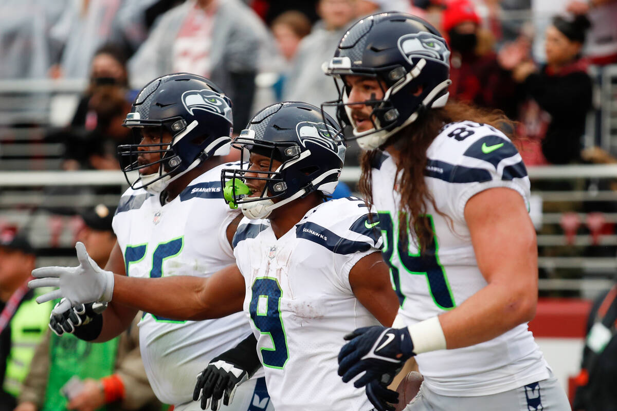 Seattle Seahawks running back Kenneth Walker III (9) celebrates after scoring a touchdown again ...