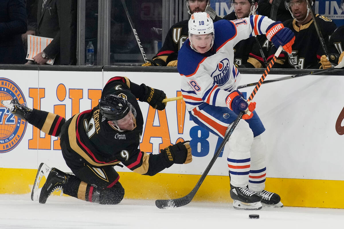 Edmonton Oilers left wing Zach Hyman (18) skates around Vegas Golden Knights center Jack Eichel ...