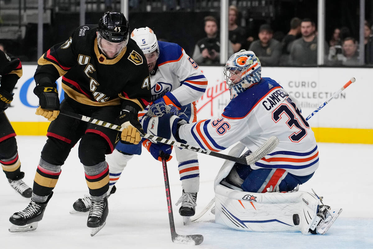 Vegas Golden Knights center Paul Cotter (43) scores around Edmonton Oilers goaltender Jack Camp ...