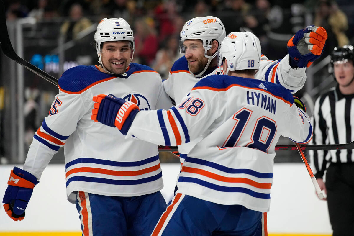 Edmonton Oilers center Leon Draisaitl, center, celebrates after scoring against the Vegas Golde ...