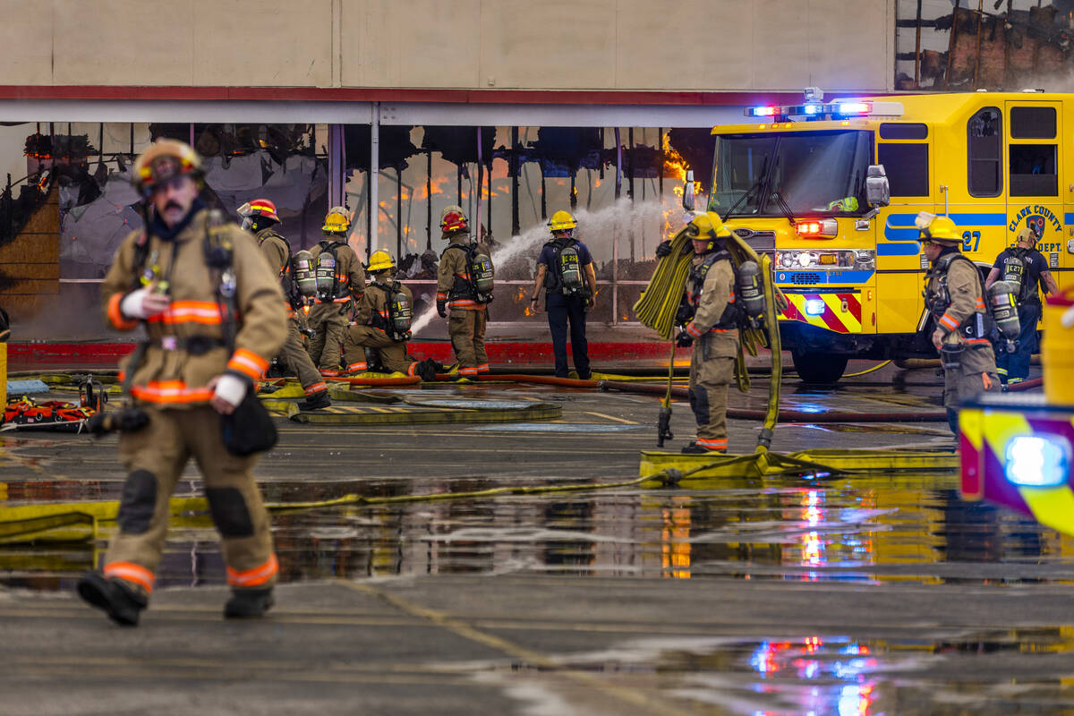 Las Vegas and Clark County Firefighters work a fully involved former Kmart store at 2975 E. Sah ...