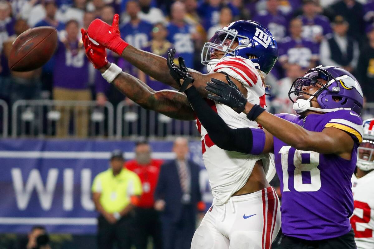 New York Giants' Xavier McKinney breaks up a pass intended for Minnesota Vikings' Justin Jeffer ...