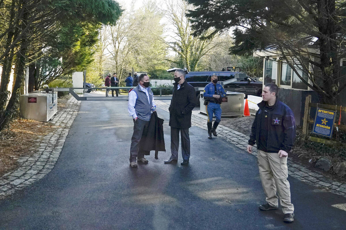 FILE - Security personnel stand at the entrance to President Joe Biden and first lady Jill Bide ...